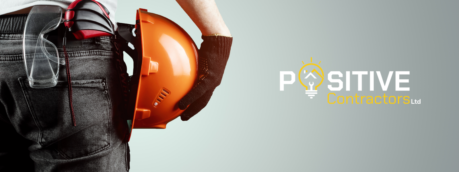 A man in a half-body holding an orange construction hat at the side of hips while in the left side, there is an icon of a bulb and a caption of Positive Contractors Ltd.